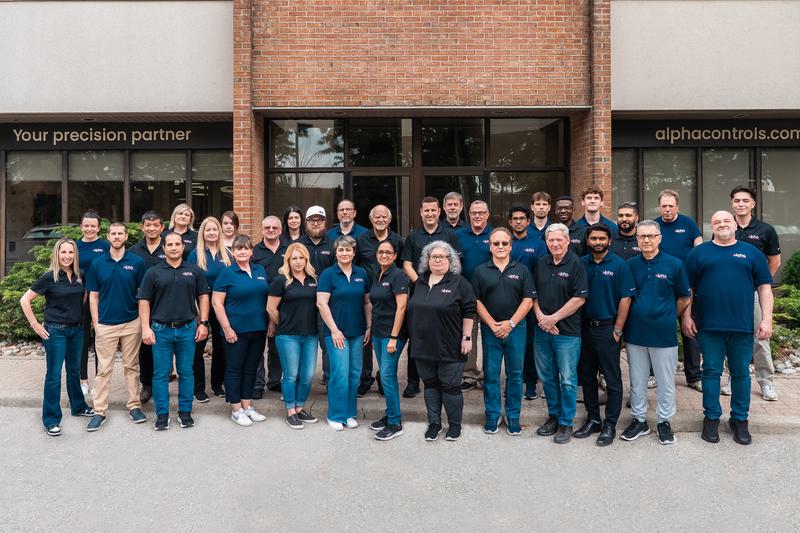 Alpha Controls full team photo outside headquarters