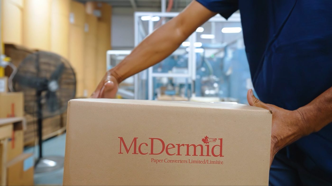 Branded McDermid box being carried to customer