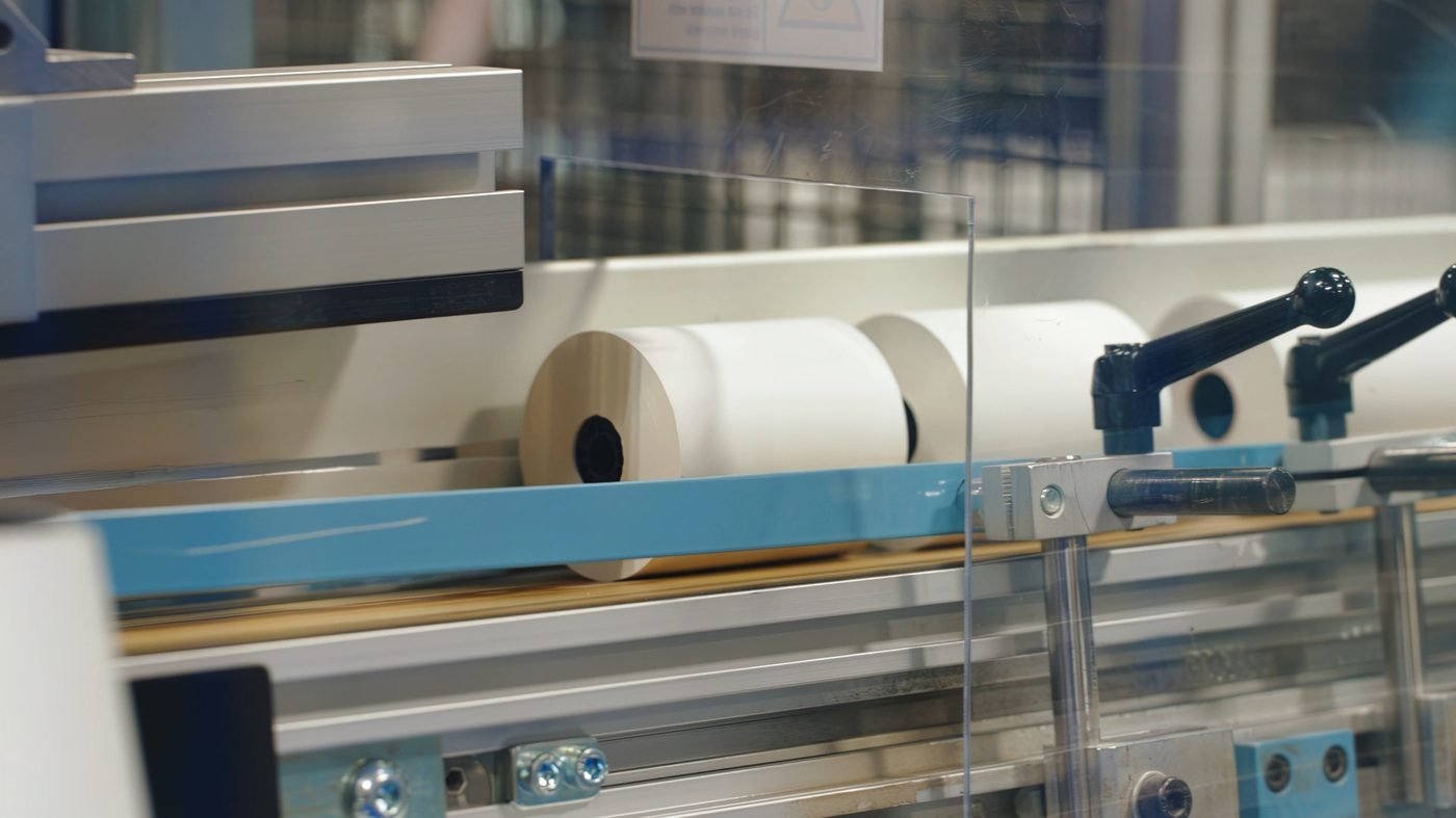 Paper rolls moving through converting line