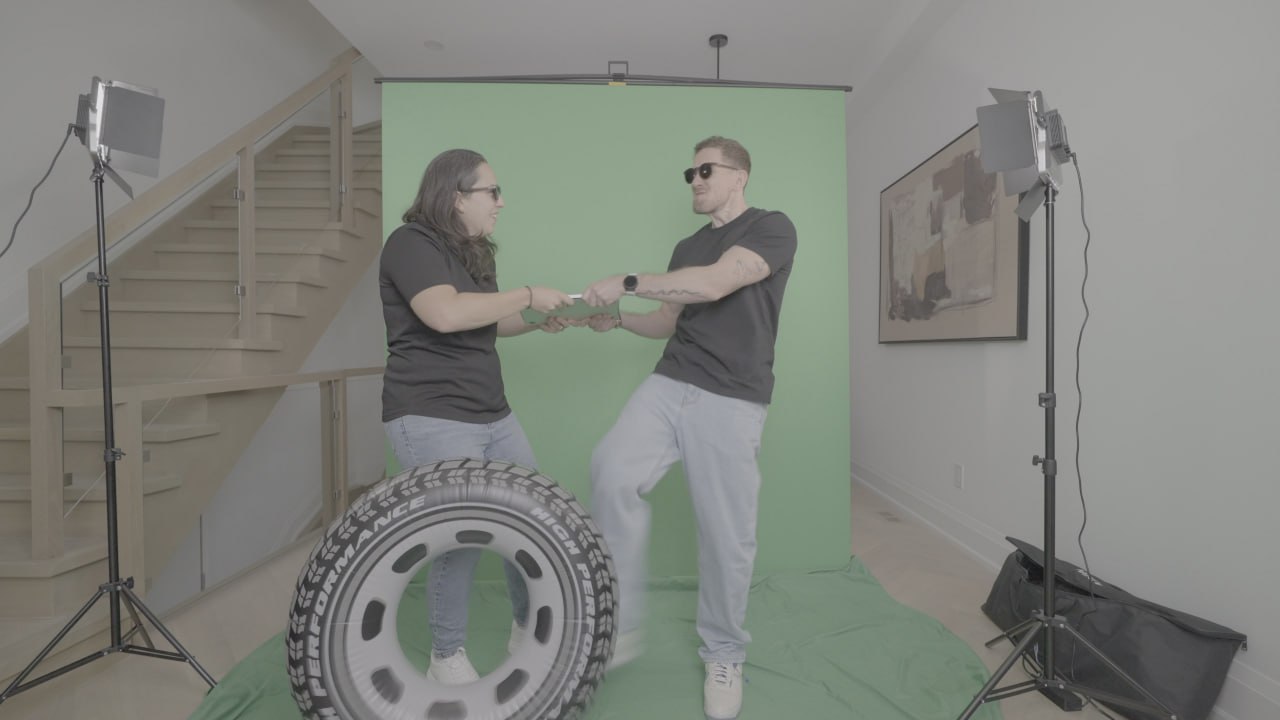 Green screen plate with tire prop and both talents